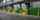 A line of green vertical storing loading docks inside of a warehouse