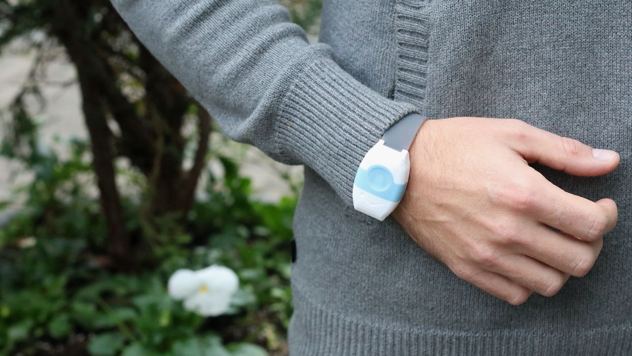 vigil wristband on a person in a gardens midsection