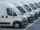 Row of white delivery vans