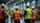 Group of workers having a safety meeting in an industrial warehouse