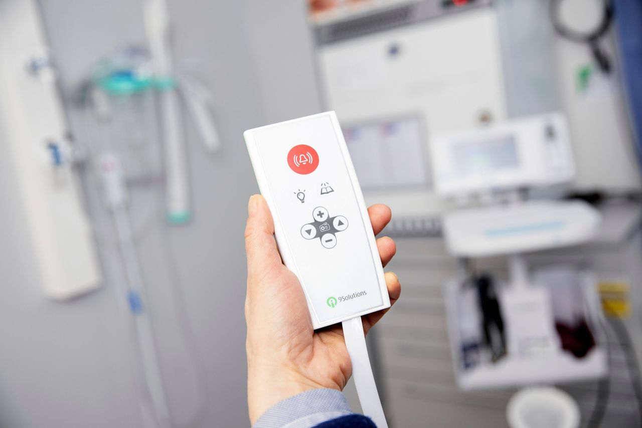 Nurse holding nurse call.