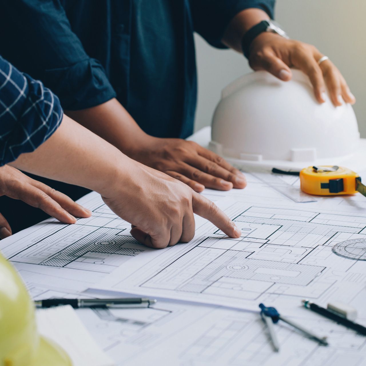 architects reviewing a blueprint