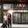 3D render of the The ASSA ABLOY RD700 High Capacity Revolving Door with people exiting through it.