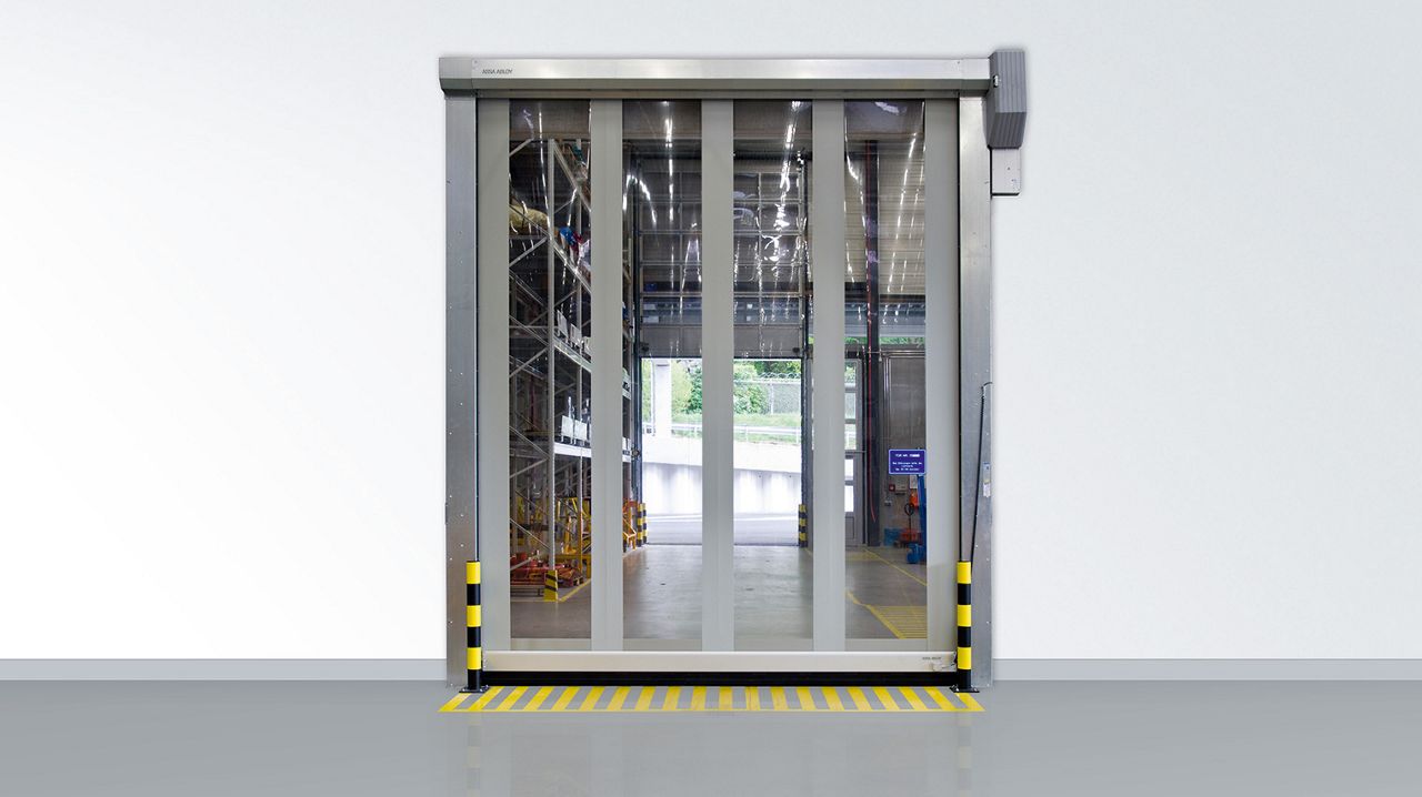 The ASSA ABLOY RR392 RapidRoll Exterior Door with steel frame in a building with white walls.