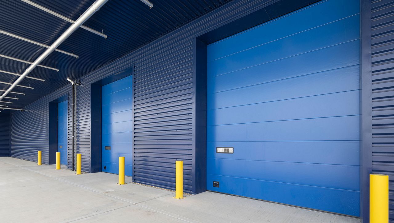 Image: An external image of a Crawford OH1042P overhead sectional door at Evri Barnsley