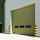 A Crawford OH1042P level access sectional door, specially supplied in a non-standard Khaki Green to harmonise with the building's cladding.