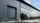 An external image of a Crawford OH1042P overhead sectional door at Tesla Centre Cambridge