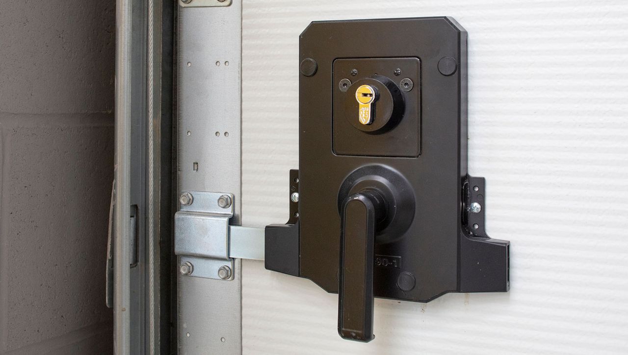 Image: An close up image of a cylinder lock on a secured by design overhead sectional door