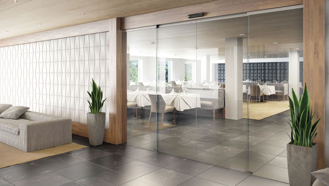 ASSA ABLOY (previously Besam) SL500 All-glass sliding door system with transparent option for interior environments.