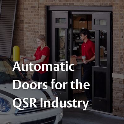 A QSR employee serves customers conveniently with the help of an ASSA ABLOY automatic door