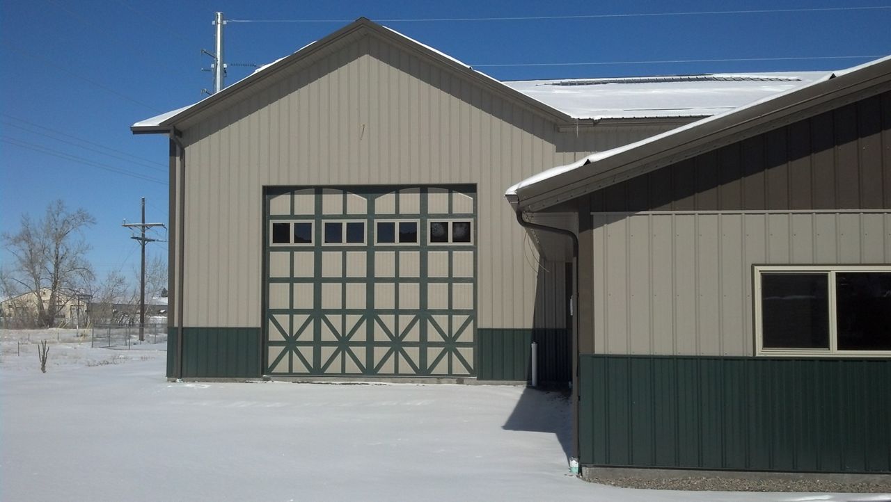 Decorative hardware gives this Amarr Classica barn door an extra authentic touch