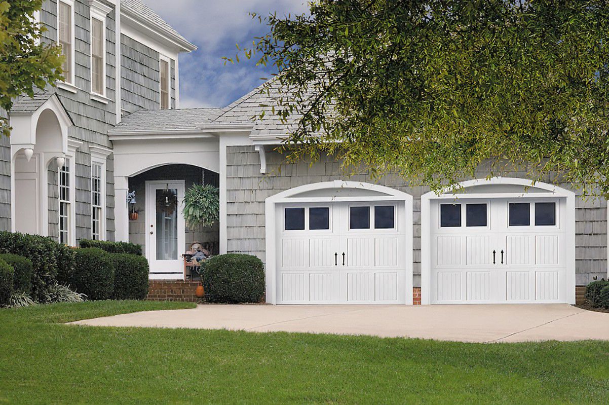 Carriage House garage doors prominently feature hinges and handles.