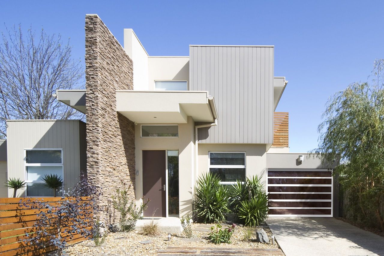 Sleek modern home accented with an Amarr Horizon glass garage door to match the front door design