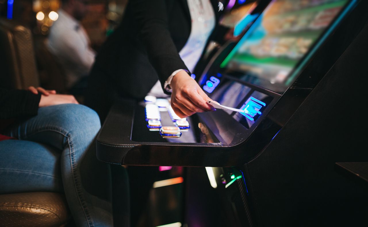 Inserting ticket into slot machine