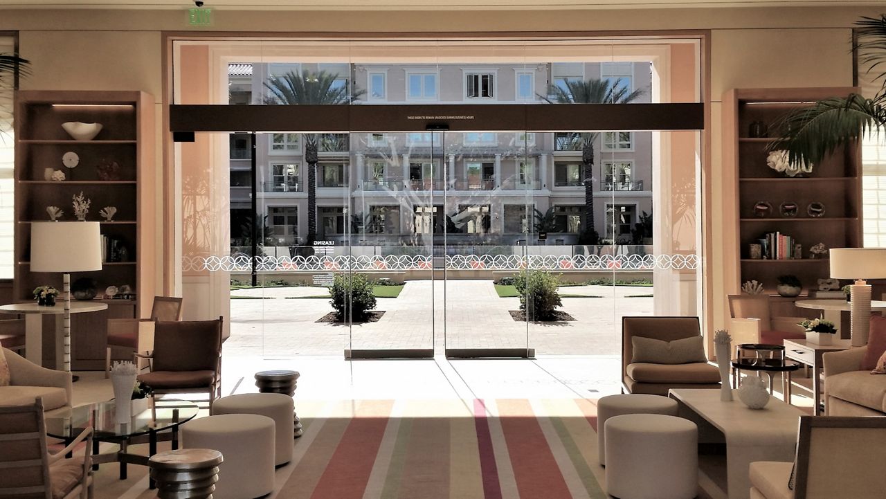 view from inside ASSA ABLOY commercial glass doors looking toward exterior