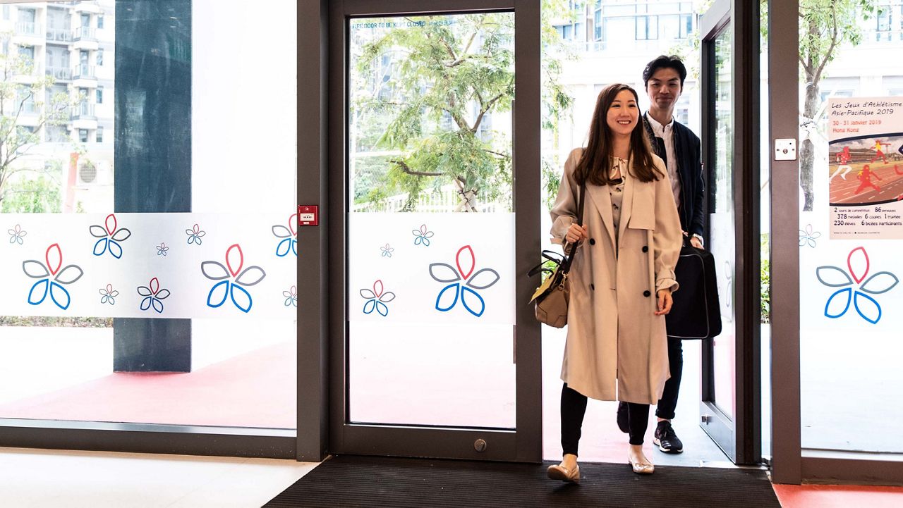 Couple entering school building