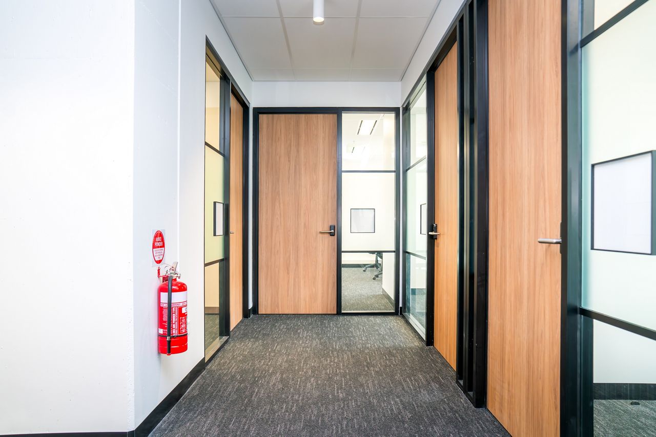 Veneer doors in an office hallway