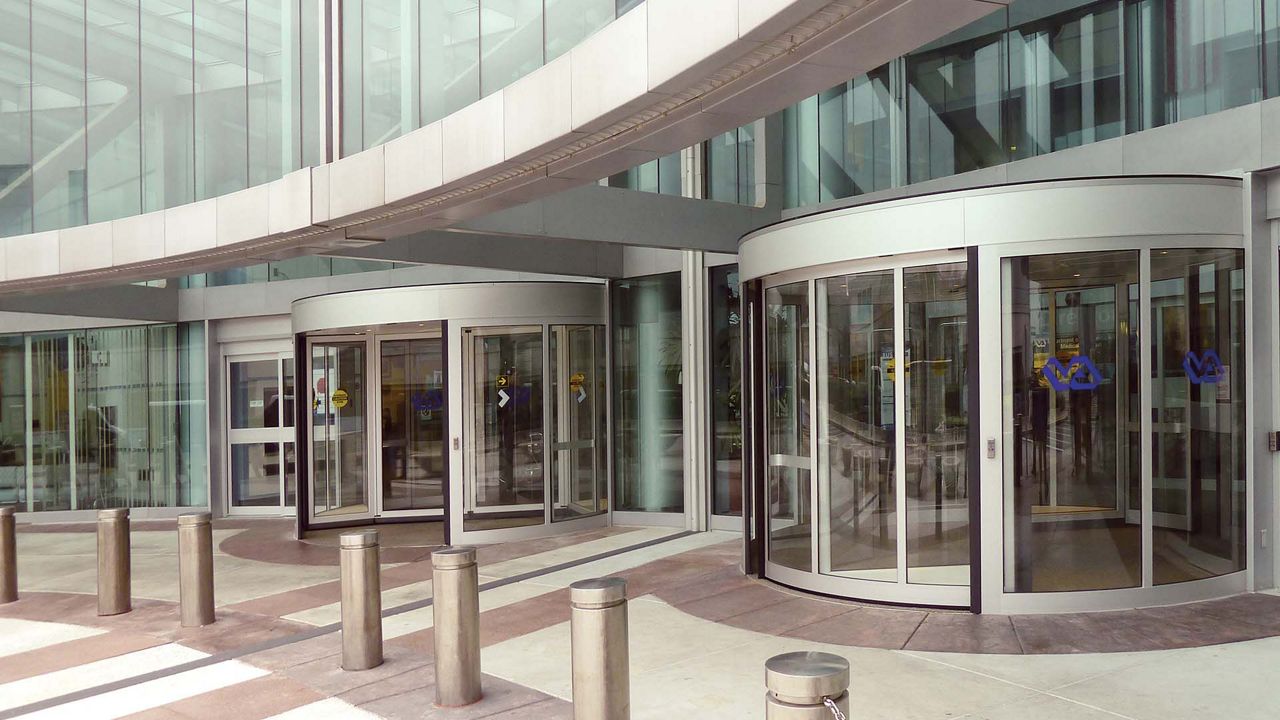 Two roller doors in a glass building. 