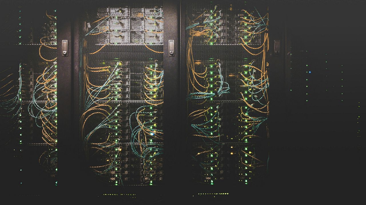 Racks of cables and data storage in a data centre facility
