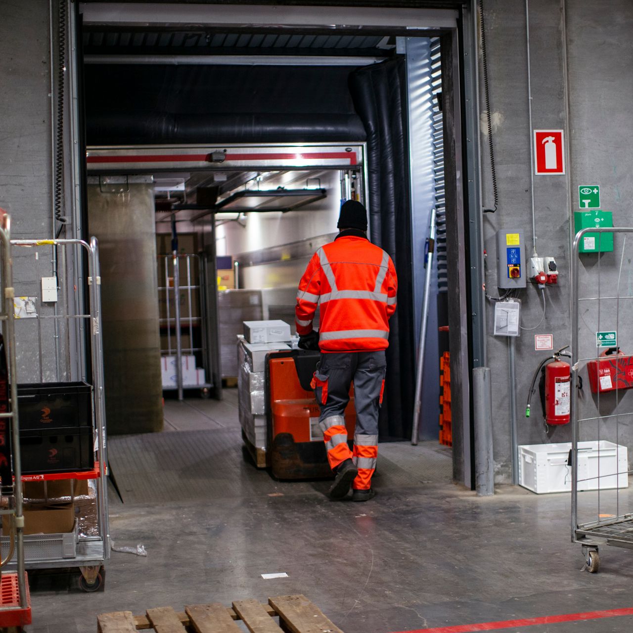 man loading stock through a dock loading system
