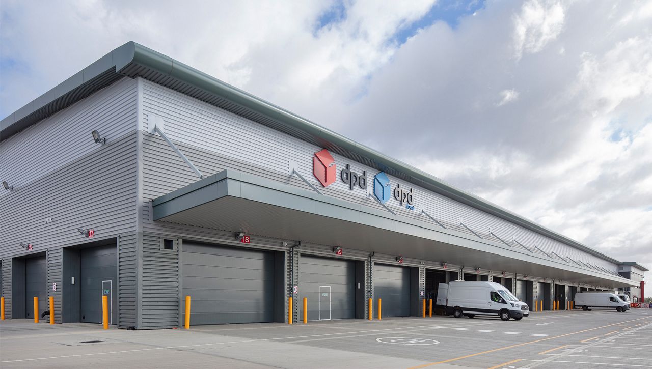A row of Crawford OH1042P sectional overhead level doors at a DPD site