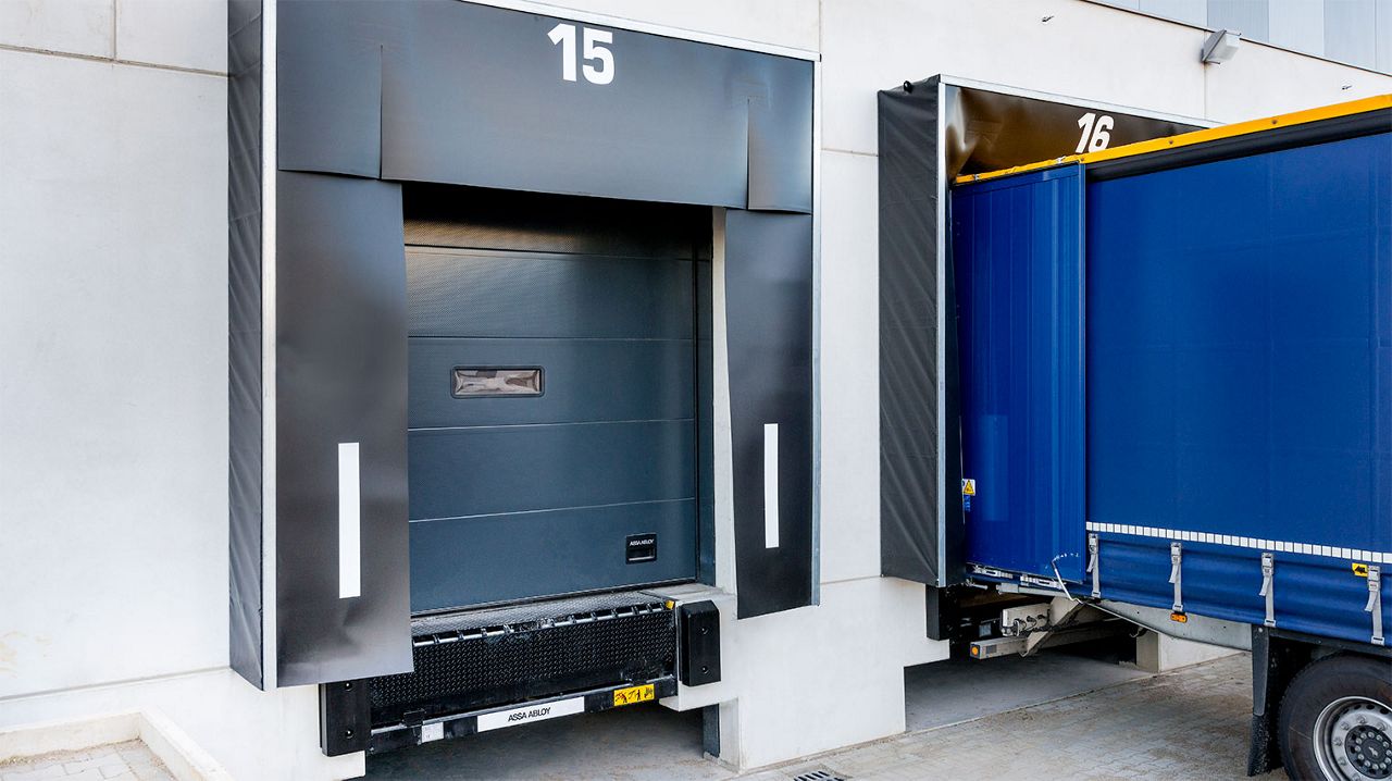 A row of loading docks with black dock shelters.