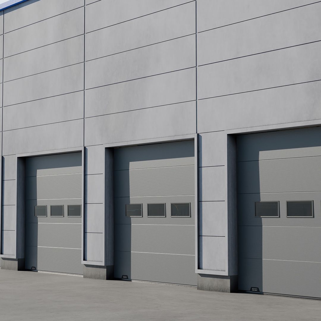 Image: Rând de trei uși secționale culisante pe verticală, gri, identice, cu ferestre, instalate pe fațada unui depozit industrial modern.