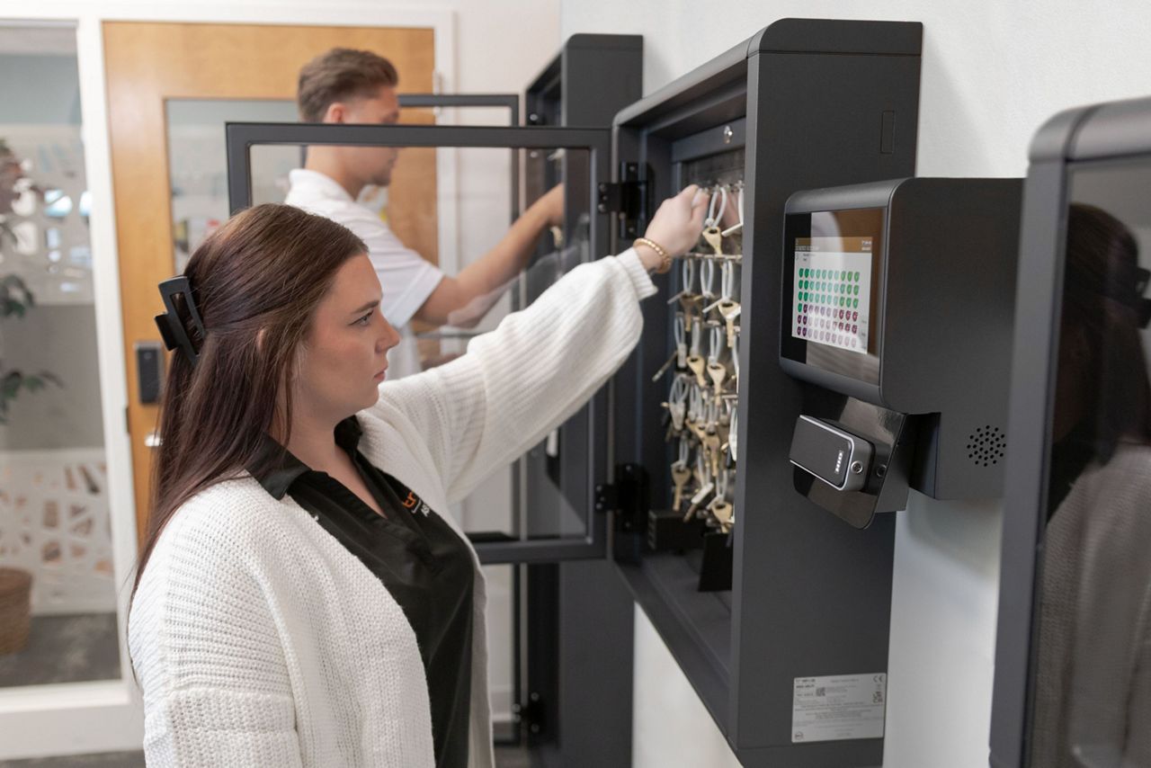 Employees opening key cabinets