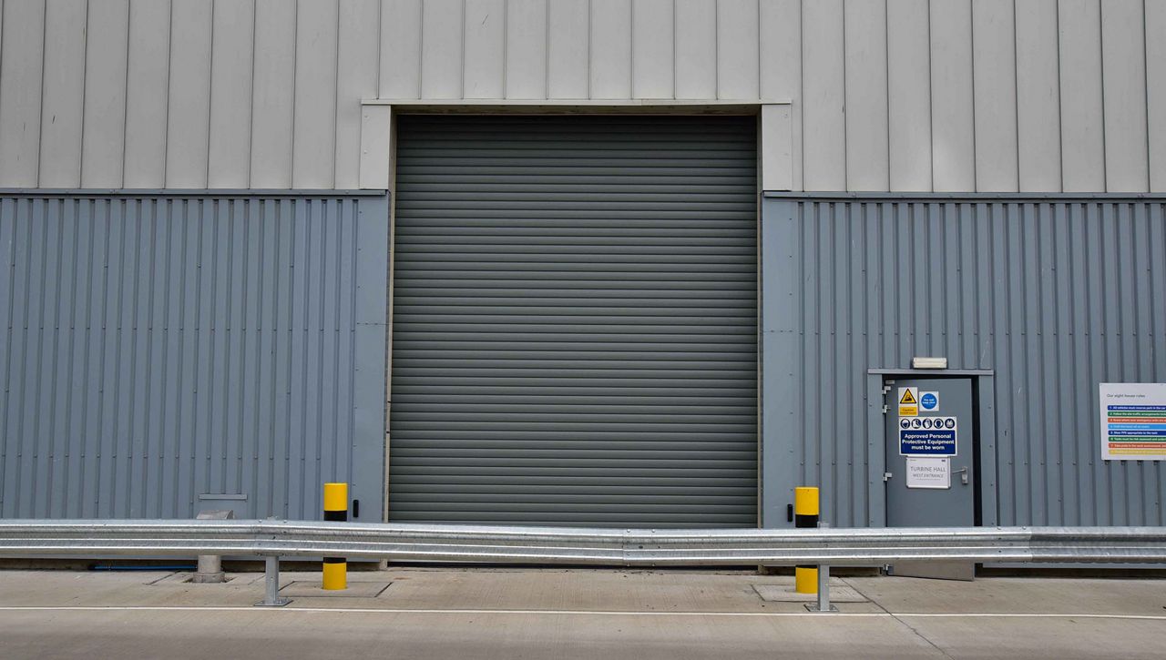 Grey enhanced insulated roller shutter in a waste transfer environment 
