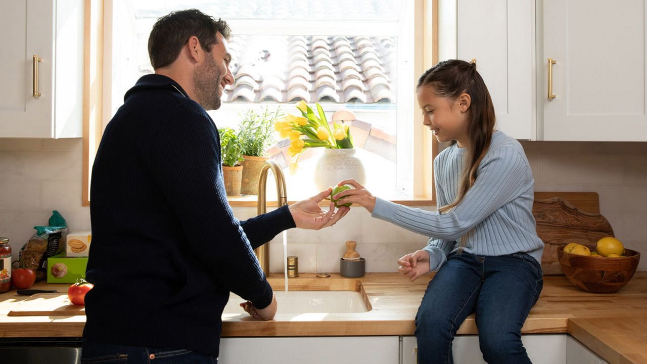 Father and daughter in the kitchen