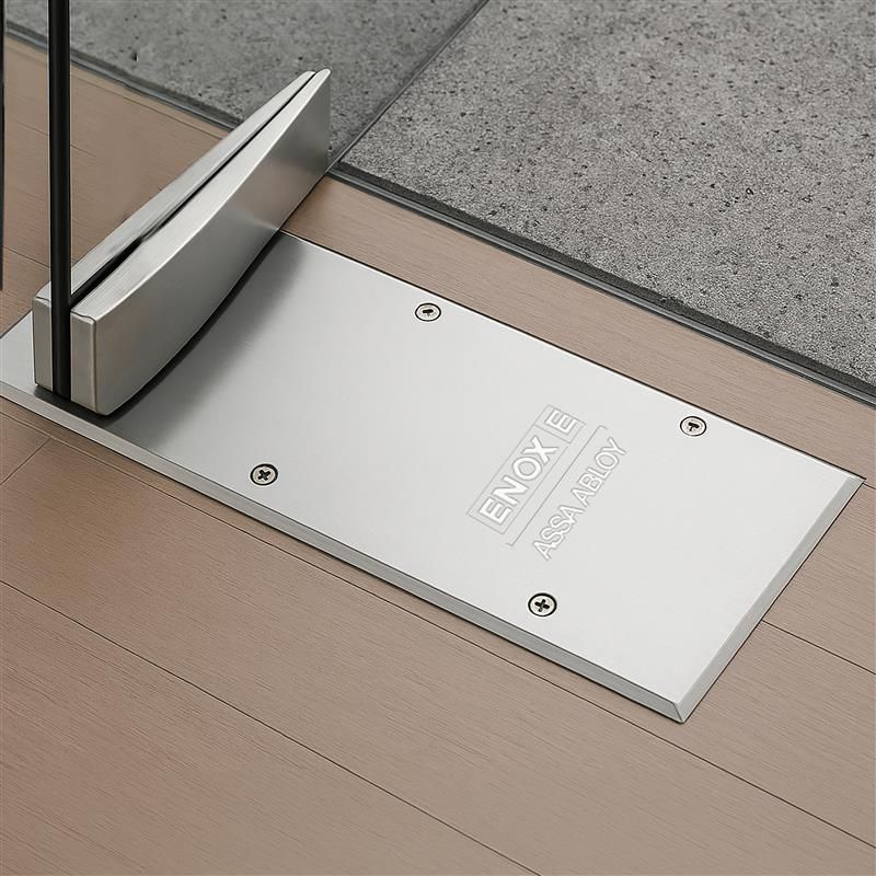 ENOX floor spring installed on frameless glass door.