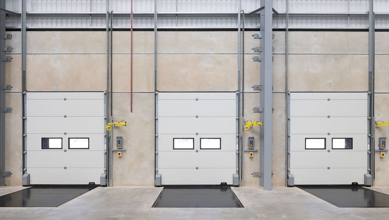Internal view of three Crawford OH1142P dual drive sectional door installed at Fradley Park