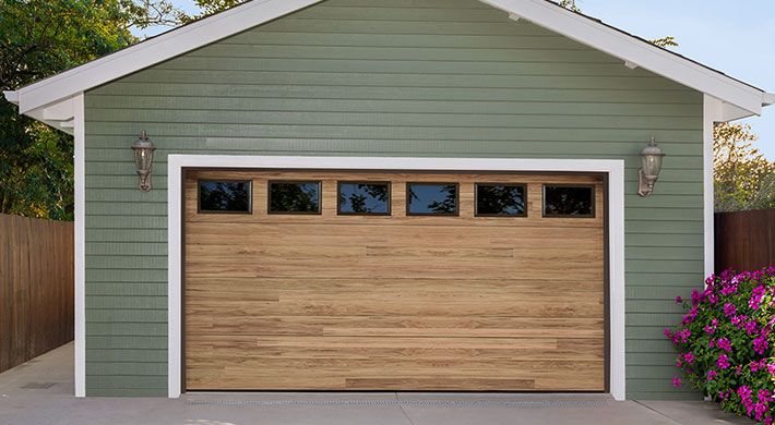 Northwoods plank garage door in Dune