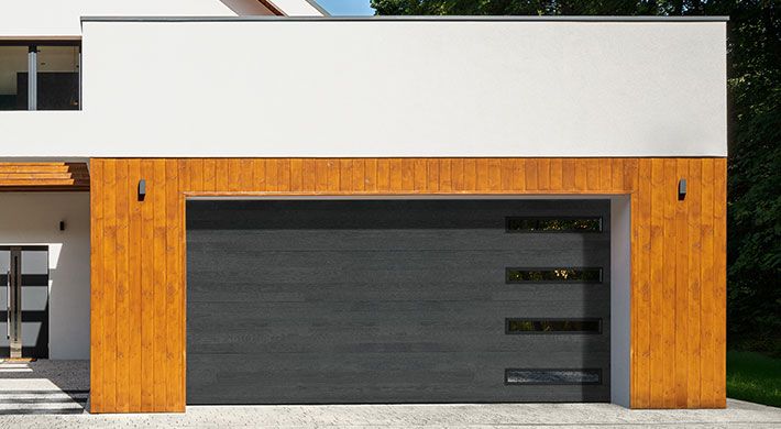 Northwoods plank garage door in Onyx with SlimLine windows