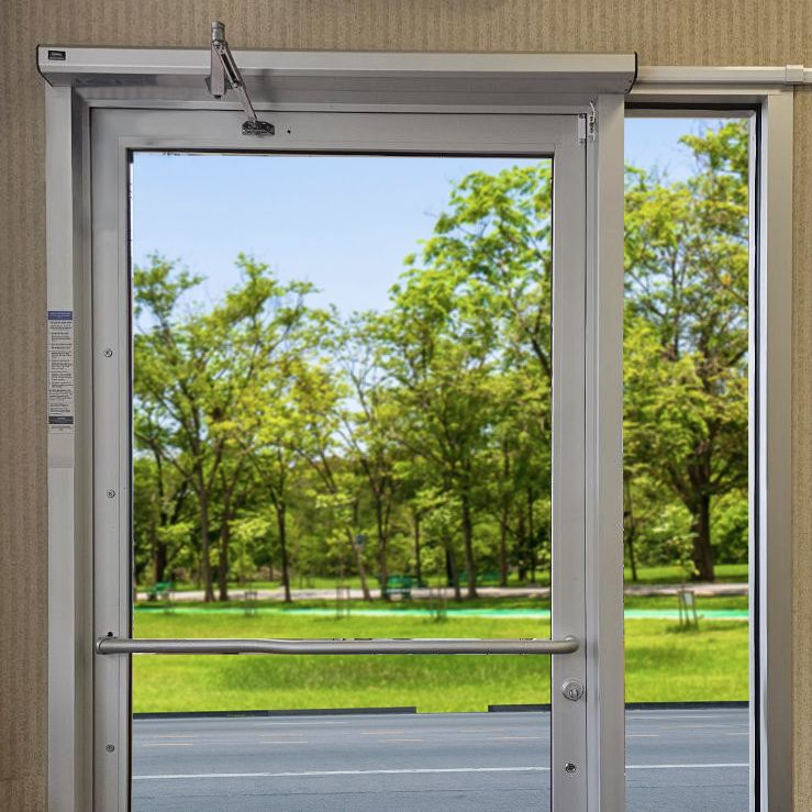 HA7 shown in clear with a push arm on an exterior glass door