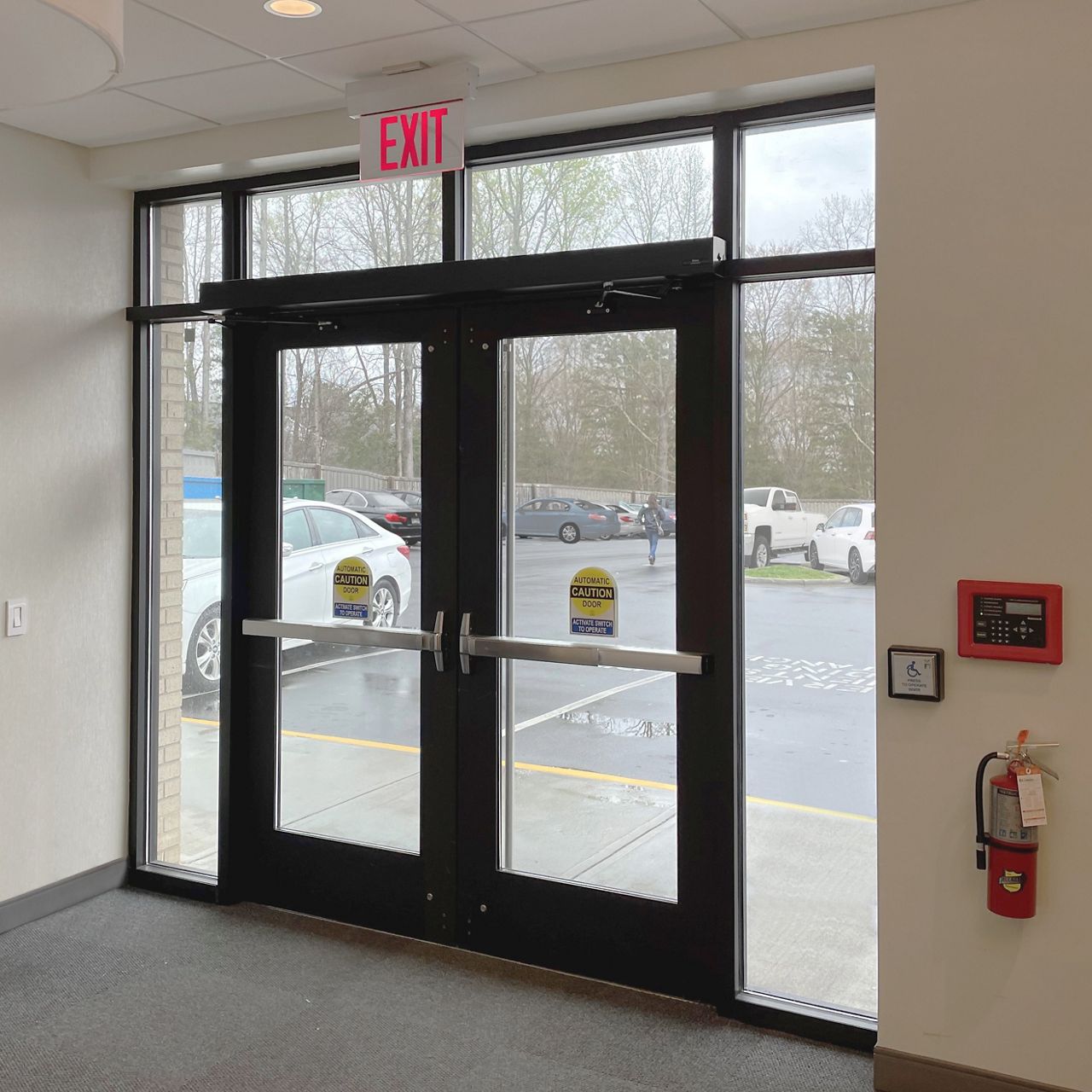 A dual HA8-LP in dark bronze on an exterior door