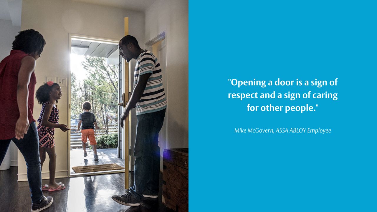 A family holding the door for one another