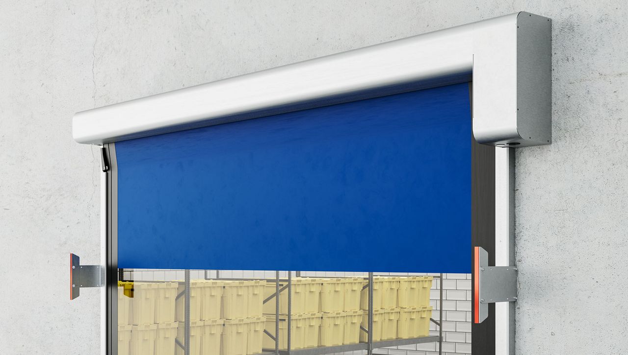 Image: A close up image of a ASSA ABLOY HS9120GHY food processing high speed door in a grey room with food.