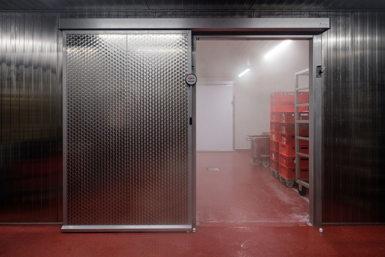 Image: sliding refrigerator door suitable for a food-safe environment.