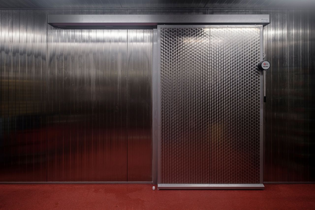 Image: sliding refrigerator door suitable for a food-safe environment.