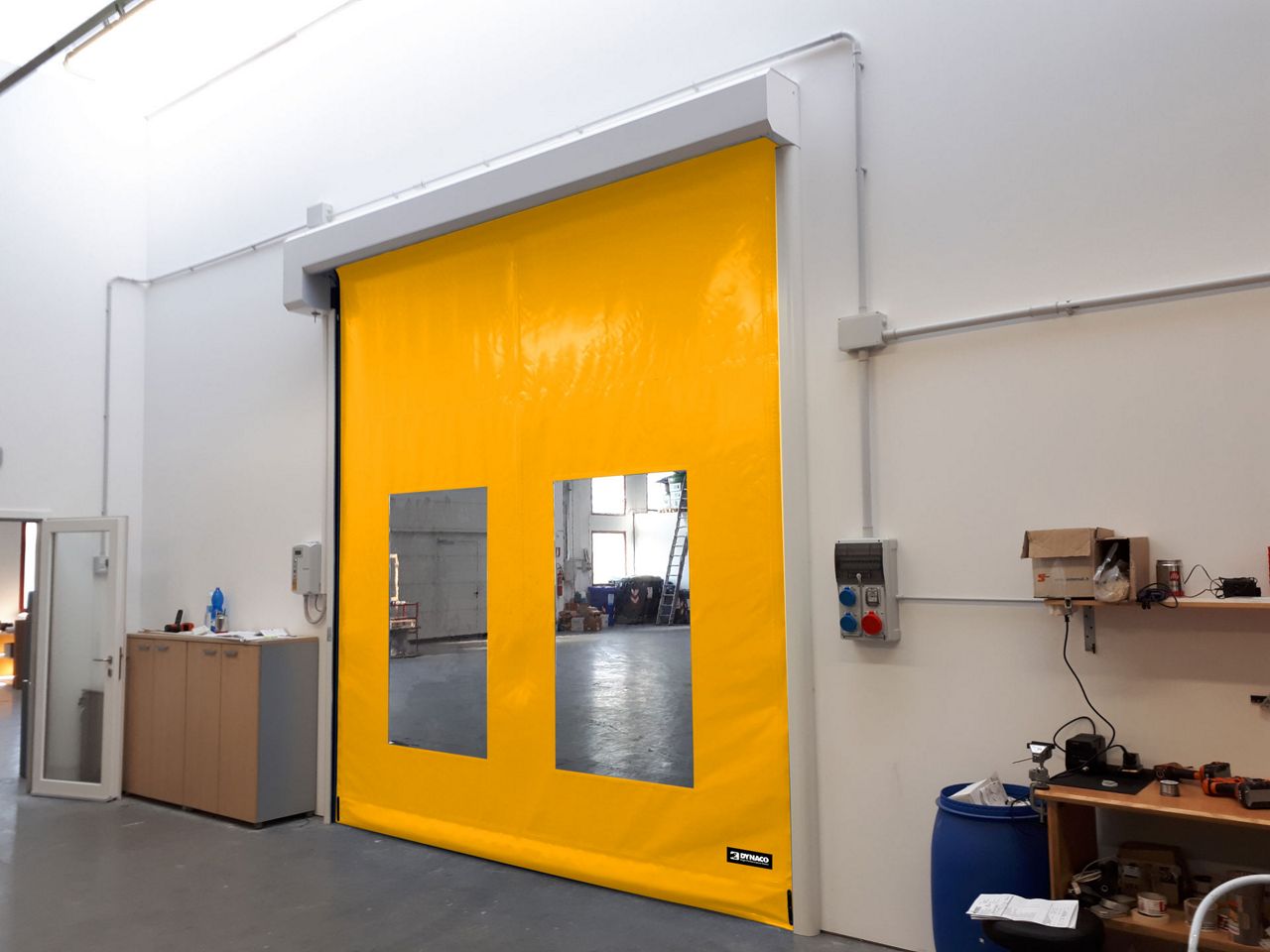 Yellow Dynaco door with windows from the side. 