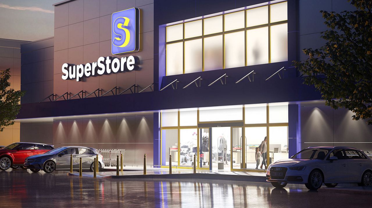 Outside a Discount and big box store with two cars infront and you can see two customers inside the store through a glass sliding door and windows.