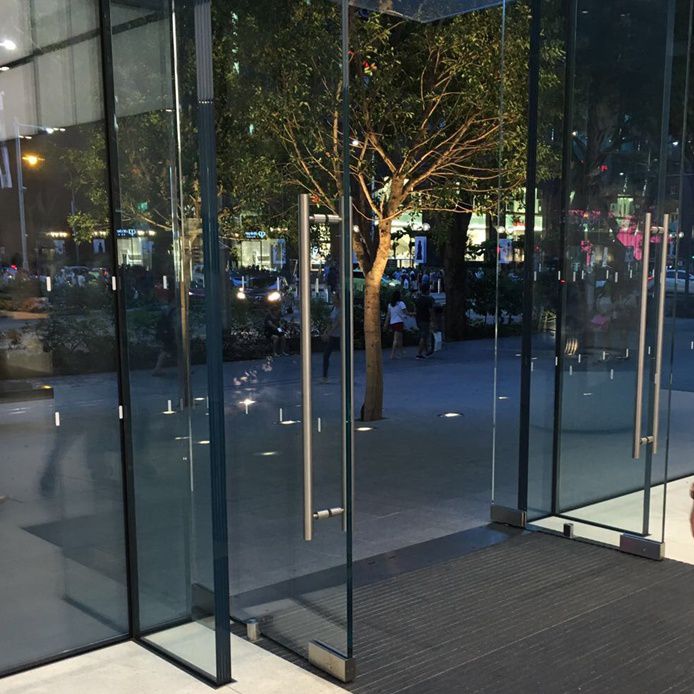 in floor closer used on a glass entrance door