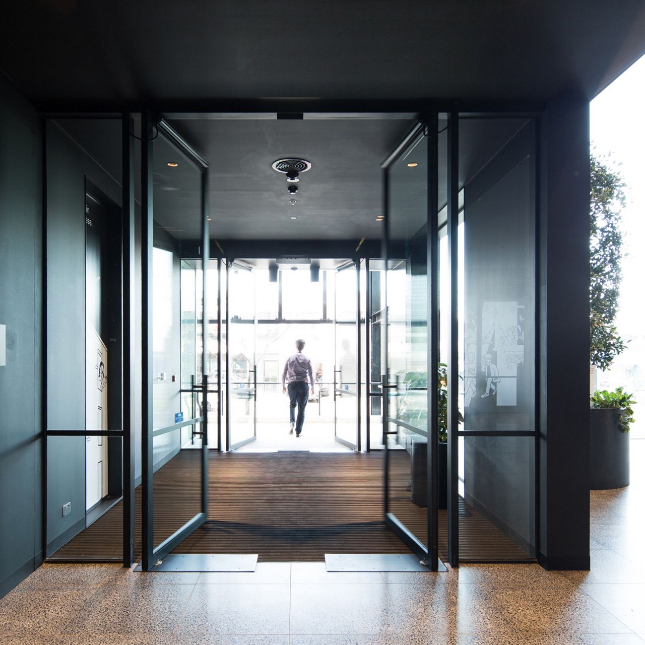 C 127 X on a double swing door in a modern office building