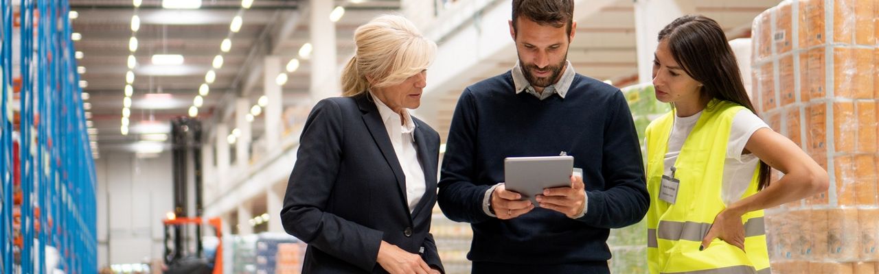 Image showing three individuals utilizing a retail device, emphasizing collaboration and efficiency in retail operations. The device enhances customer service, inventory management, and sales tracking, contributing to a seamless retail experience.