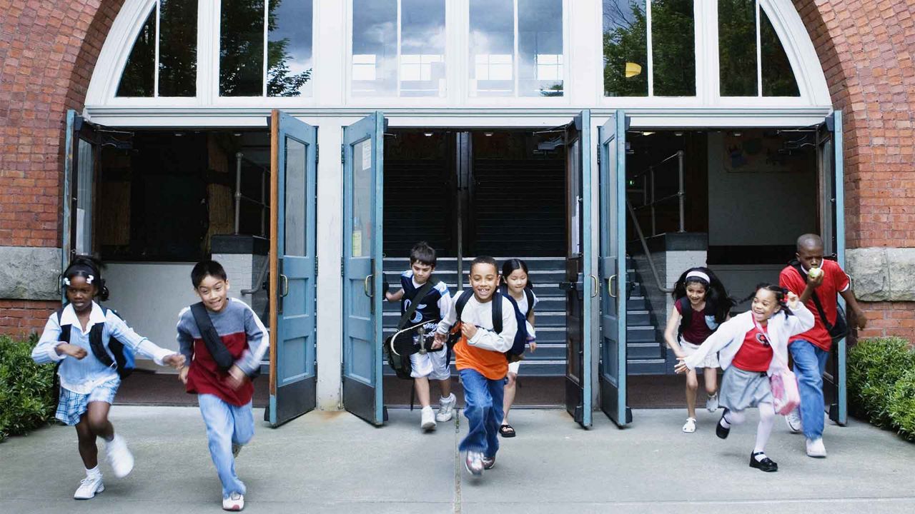 Children running out of school