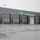 7 portes sectionnelles Crawford ASSA ABLOY dans une entreprise de transport par autobus