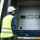 ASSA ABLOY service technician with a tablet talking to a customer