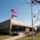 School brick building with americian flag in front