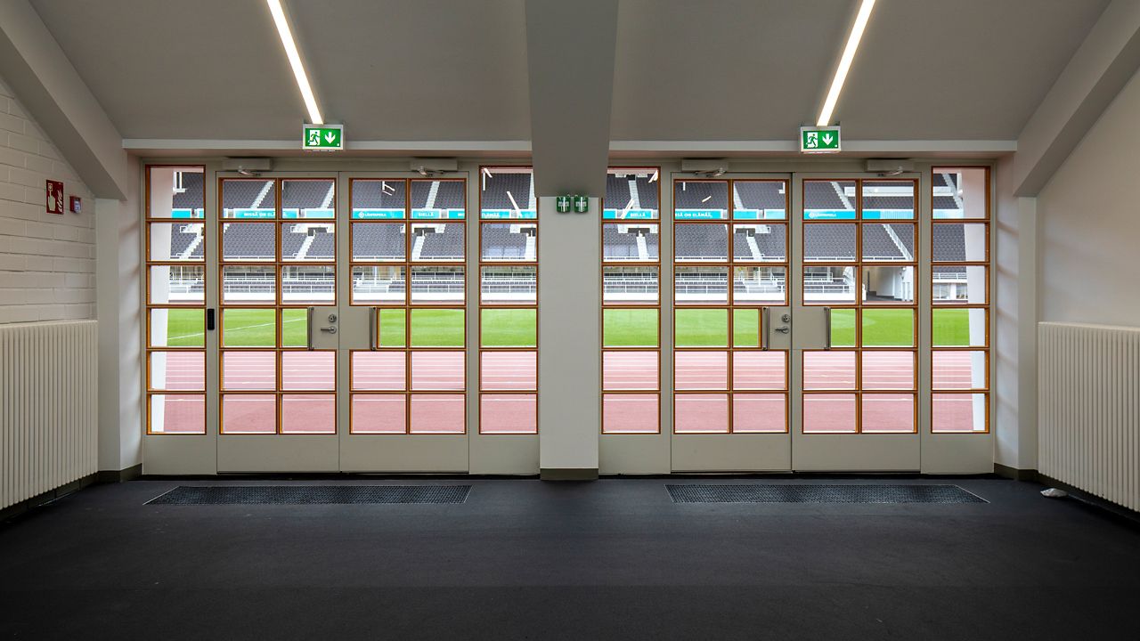 Glassdoors leading to the stadium's field